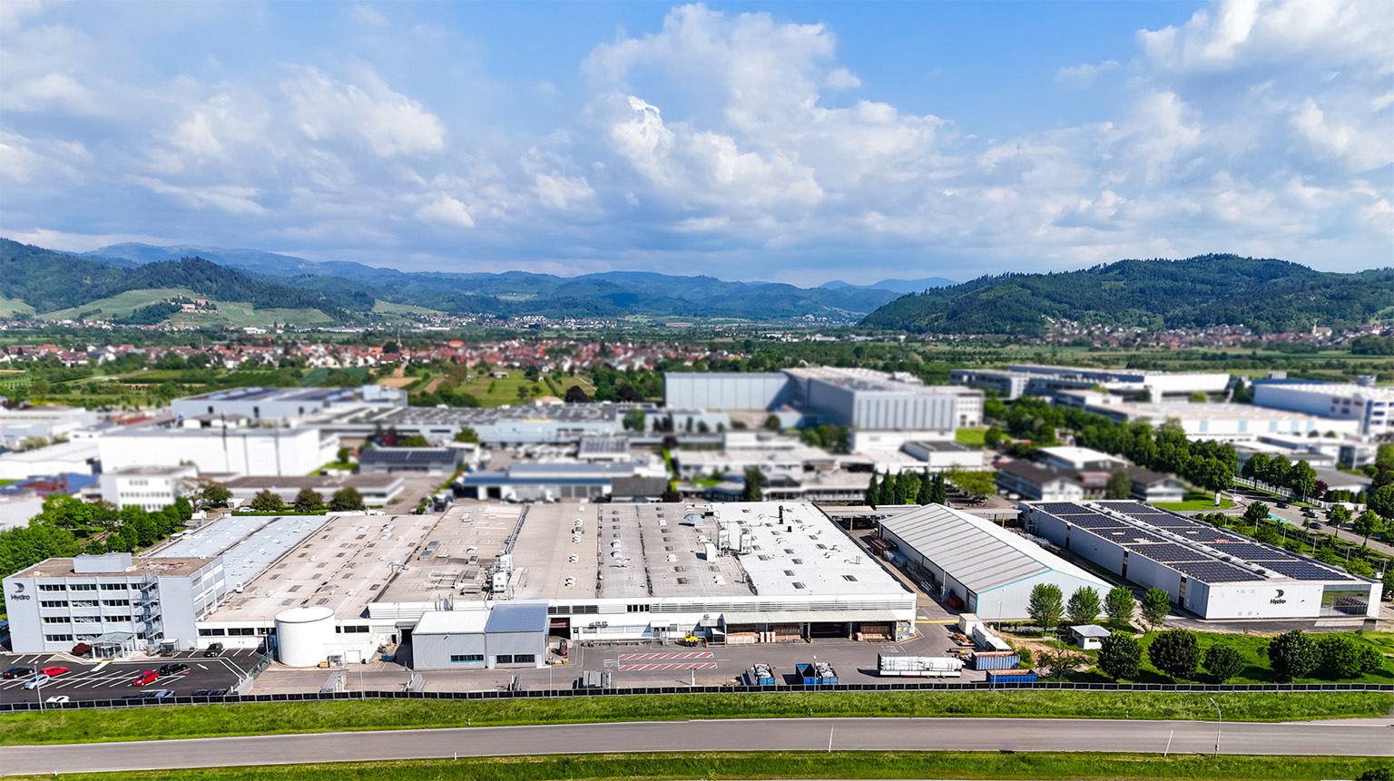 a large industrial area with buildings and a road