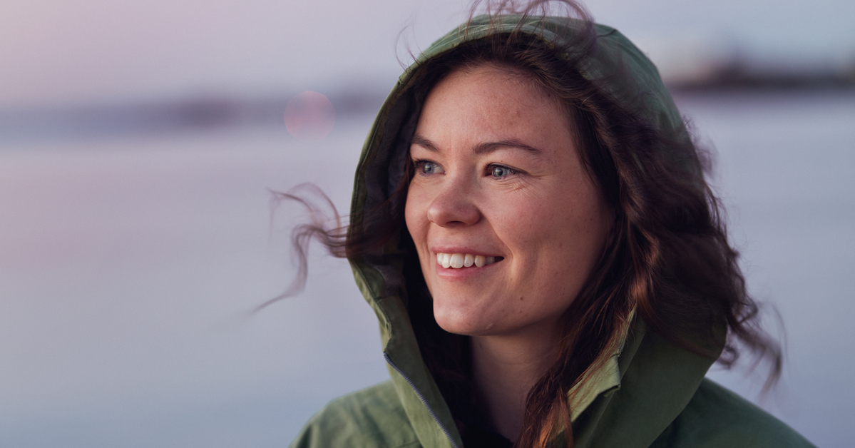 a woman smiling at the camera
