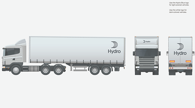 large truck with logo placed top back, front and center above cab, front and center on rear doors.