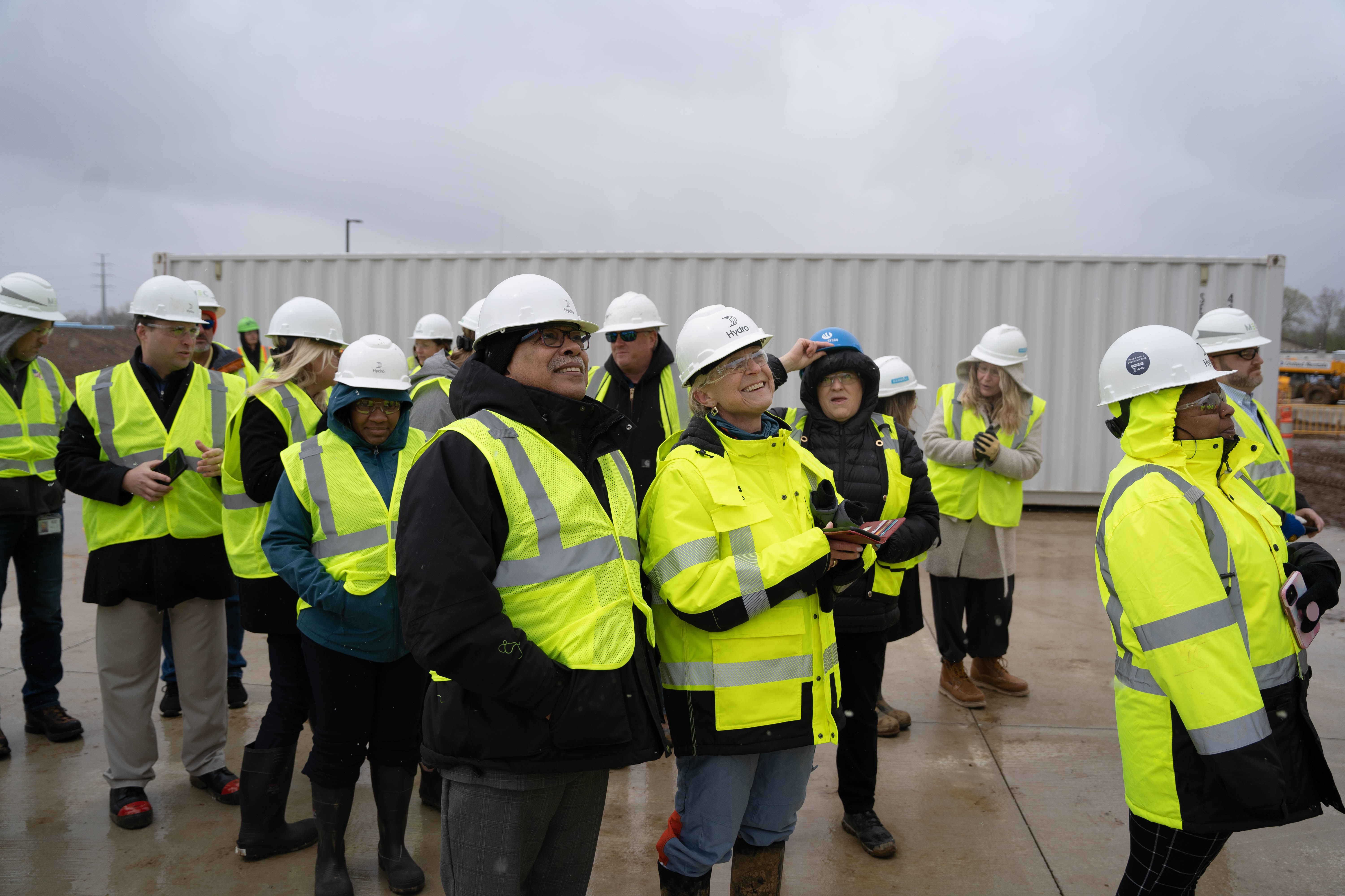 a group of people wearing hardhats and reflectors