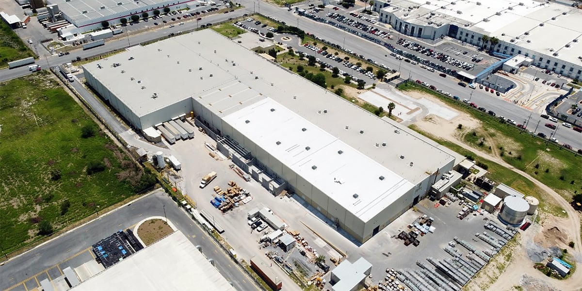 a large building with a parking lot