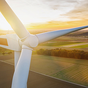 a view of a wing of an airplane wing and the ground below