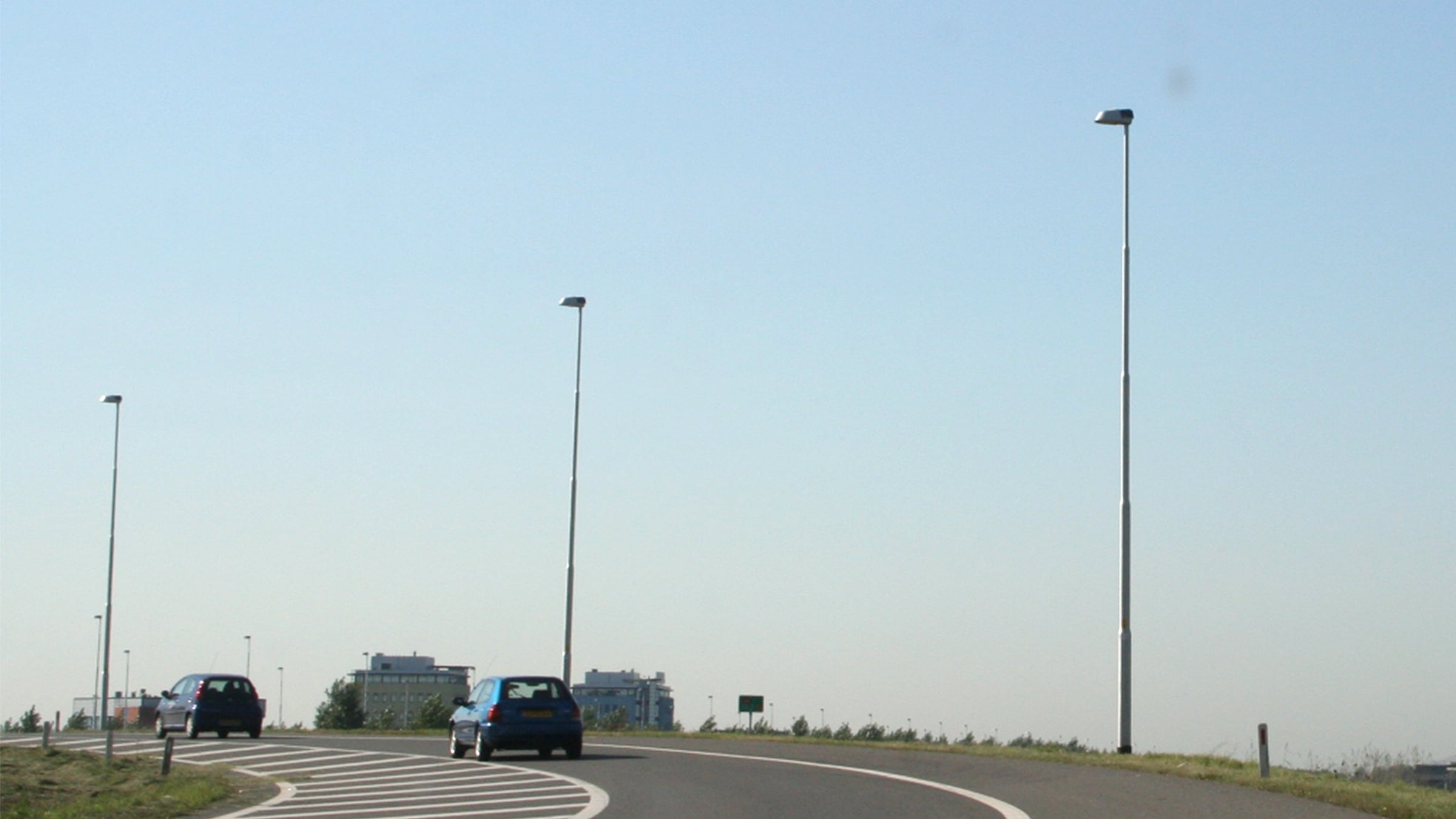 Aluminium light poles beside a road