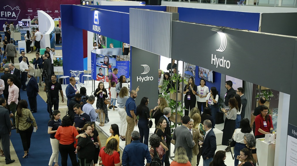 a group of people standing in front of a sign