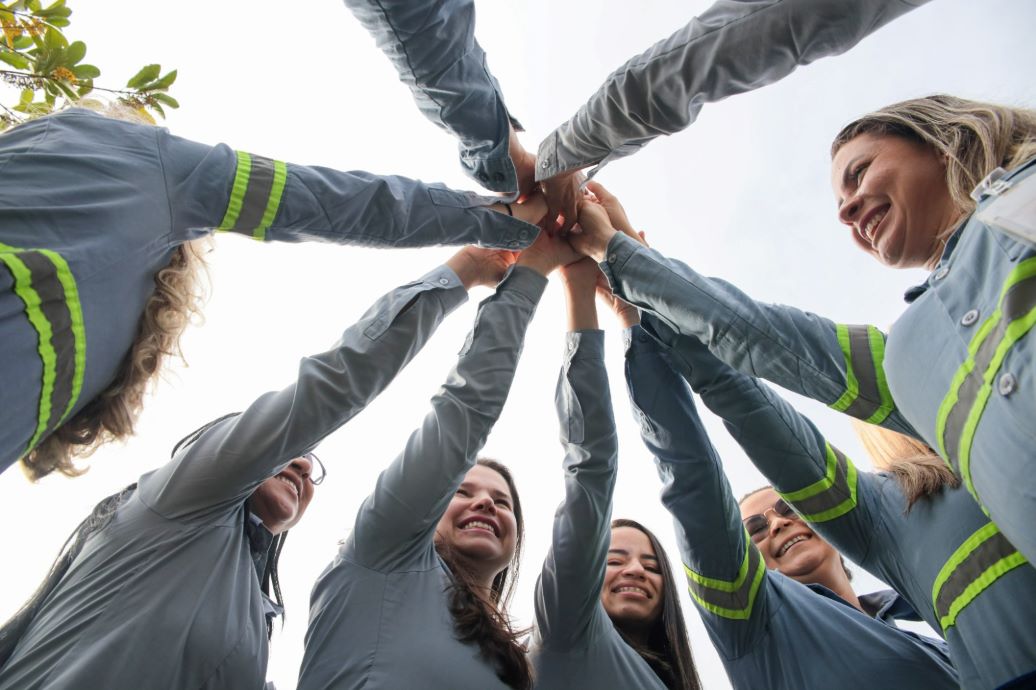 a group of people raising their hands